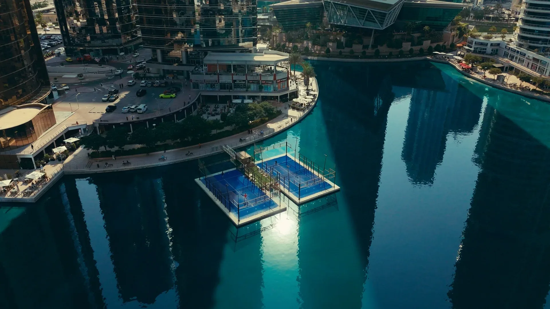 The floating padel courts of Padel Islands in Dubai Marina, seen from above